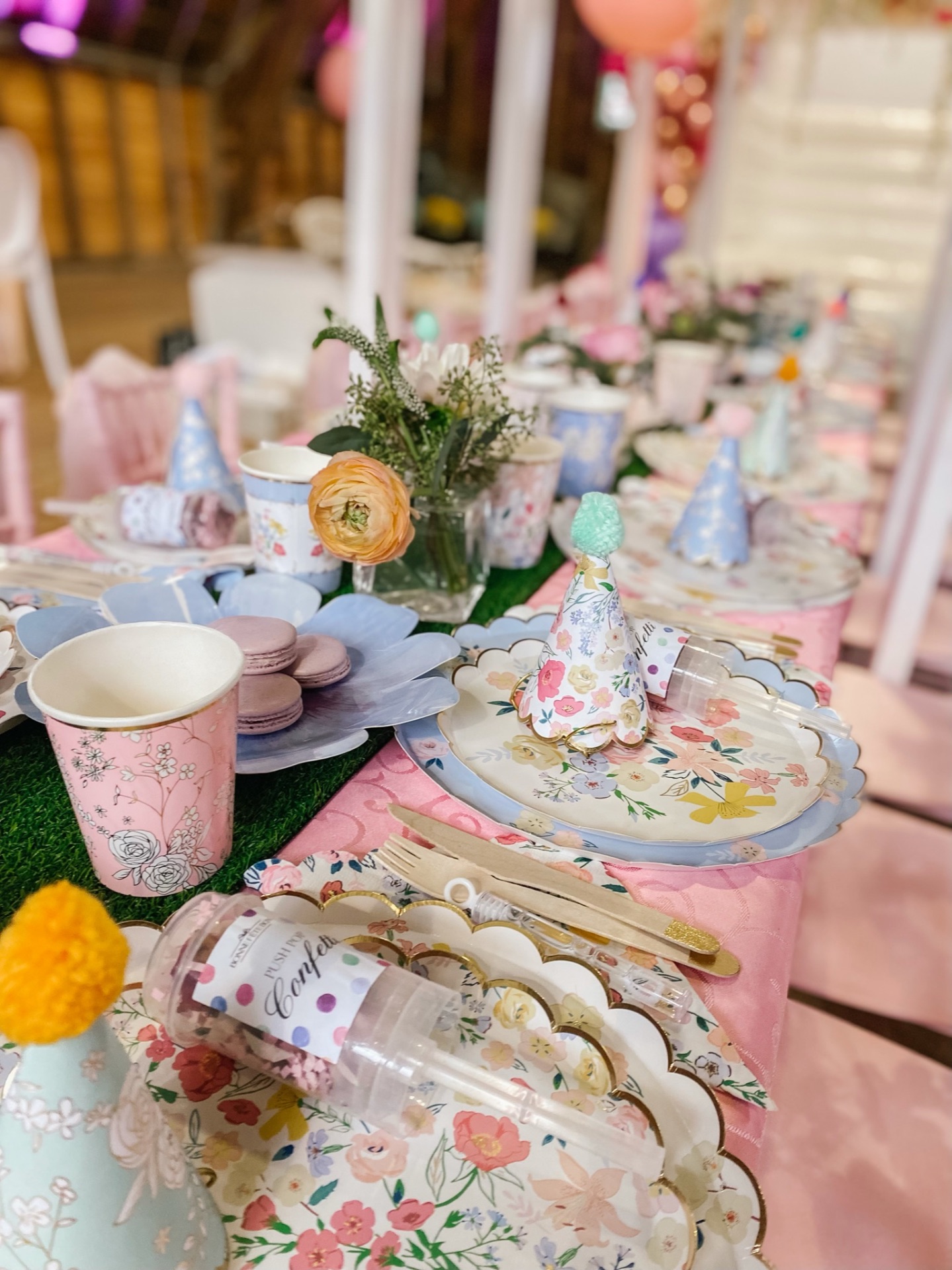 Floral place setting with macarons and patterned linen
