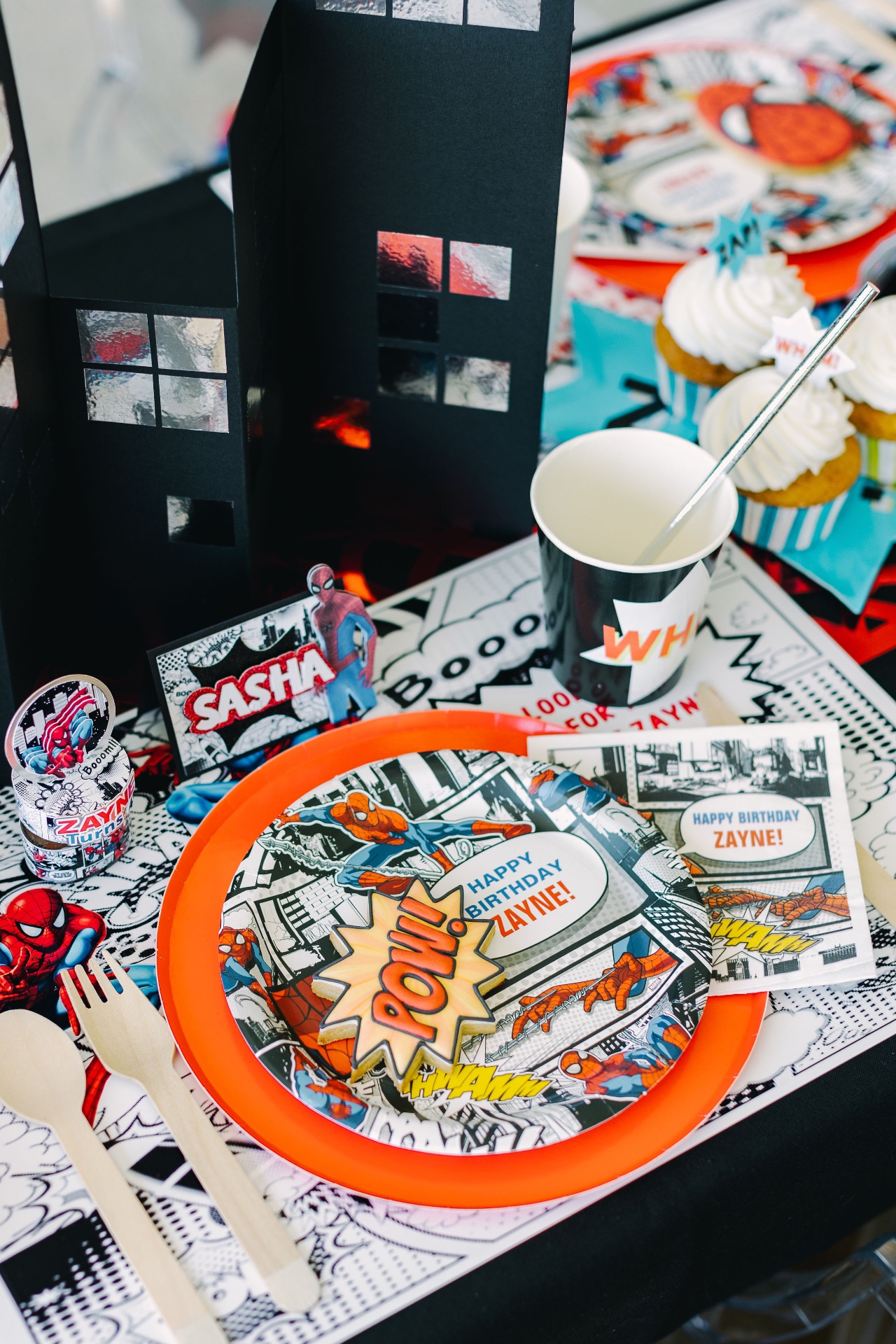 Spider-Man place setting with city-building centerpiece and personalized card