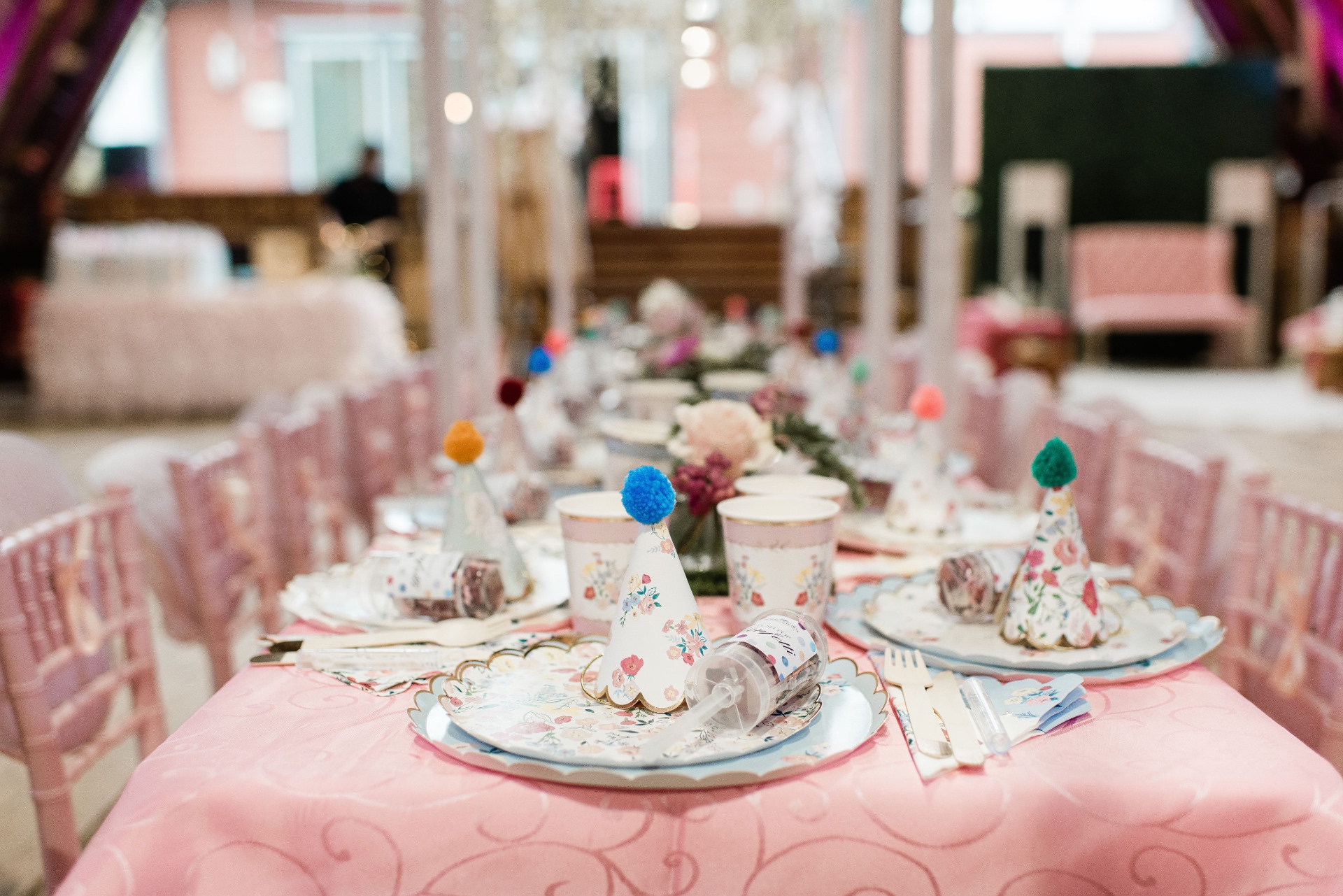 Wide shallow-focus pink table setting