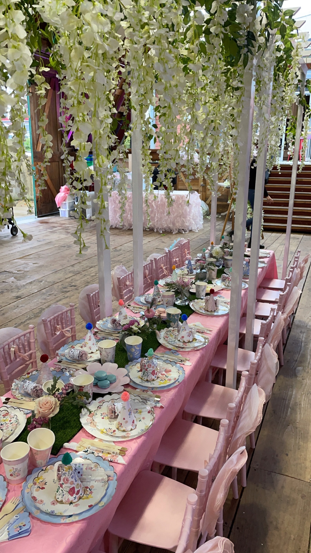 Angled view of the pink floral table and venue